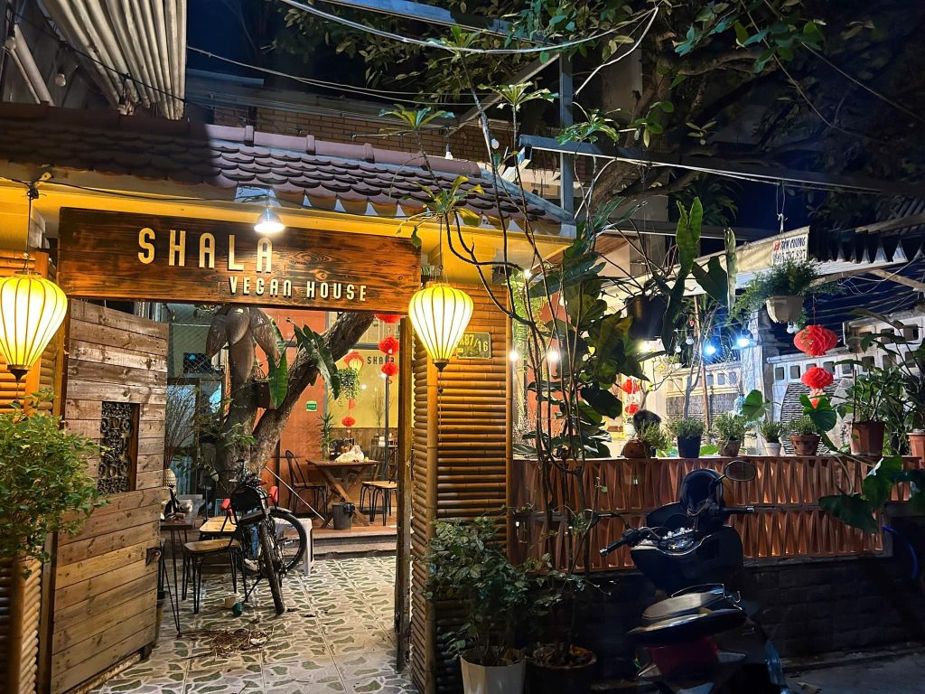 The cozy interior, accompanied by peaceful Buddhist melodies, creates a calming and relaxing atmosphere for diners visiting Shala Vegan House